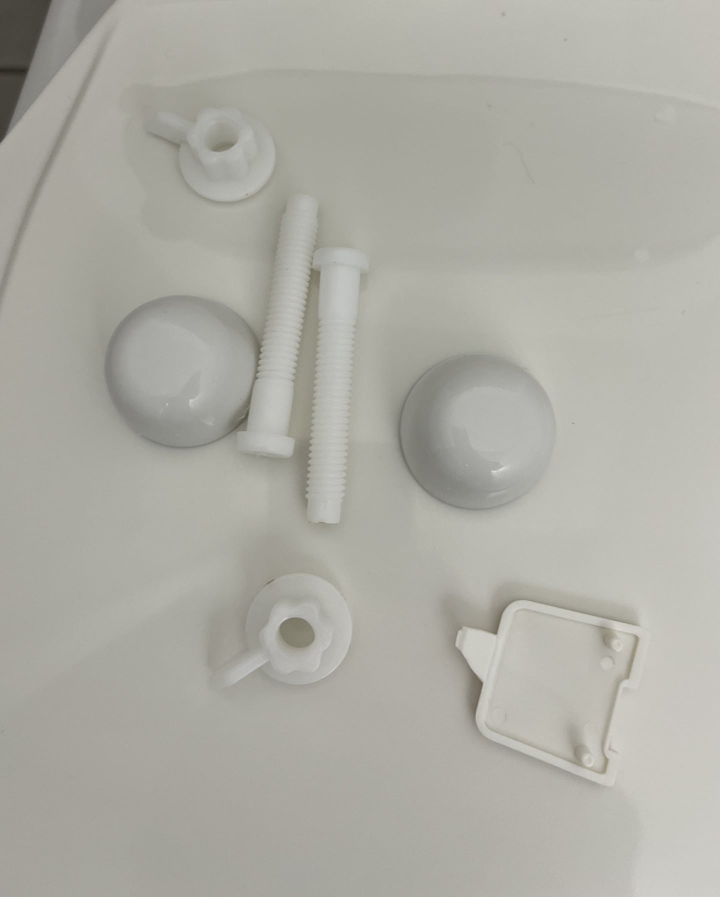 Clean removable bathroom hardware after detail cleaning.