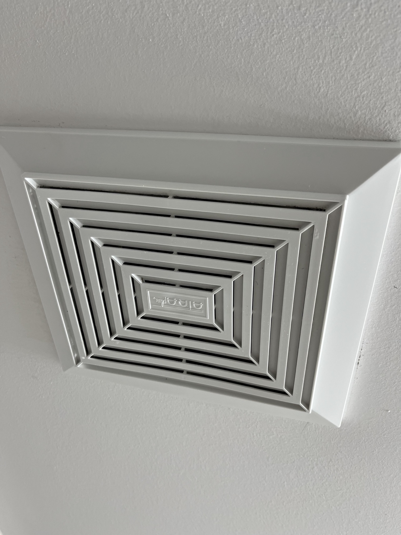 Clean bathroom fan cover after detail cleaning.